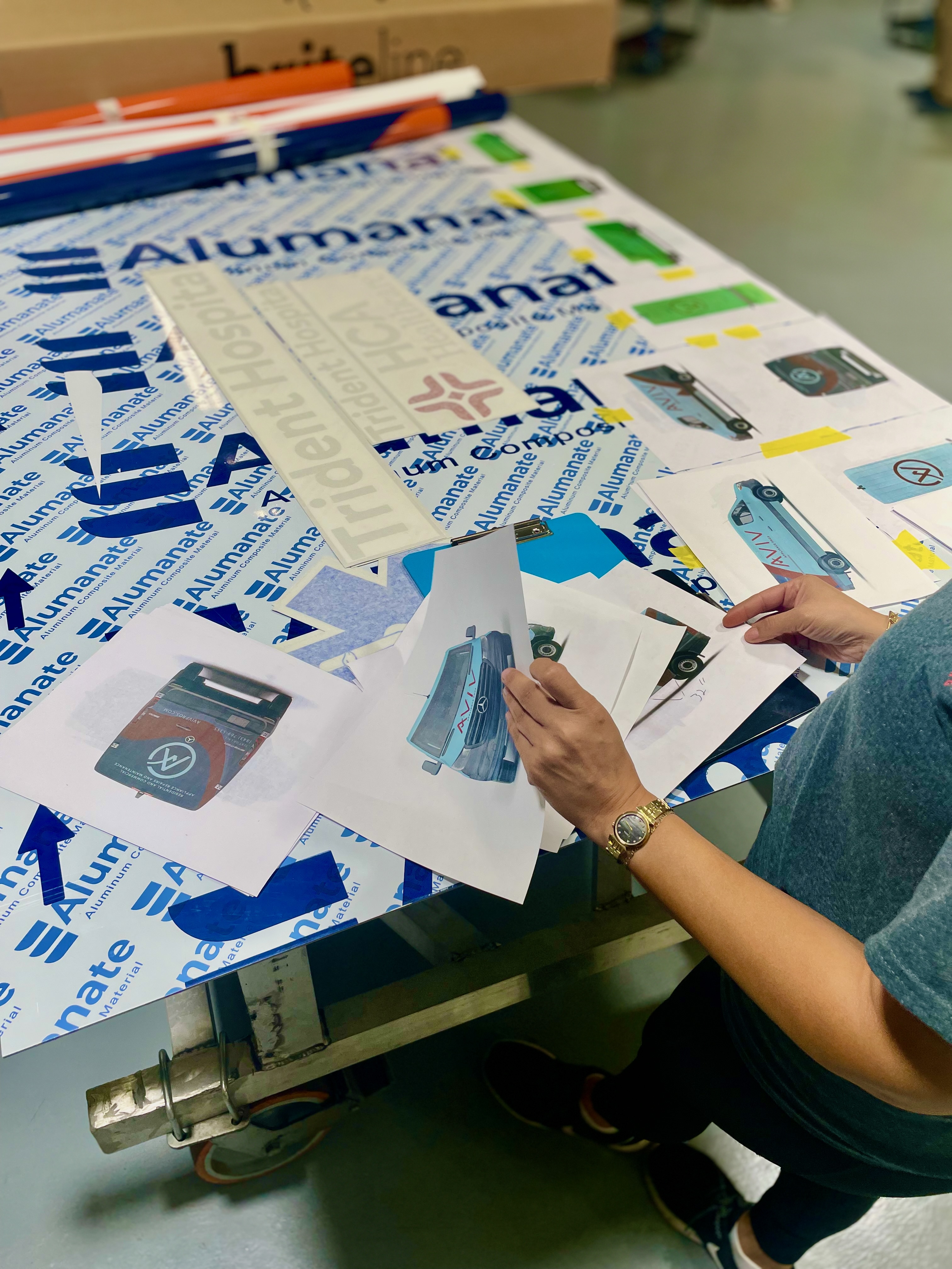 Technician preparing premium vinyl for production